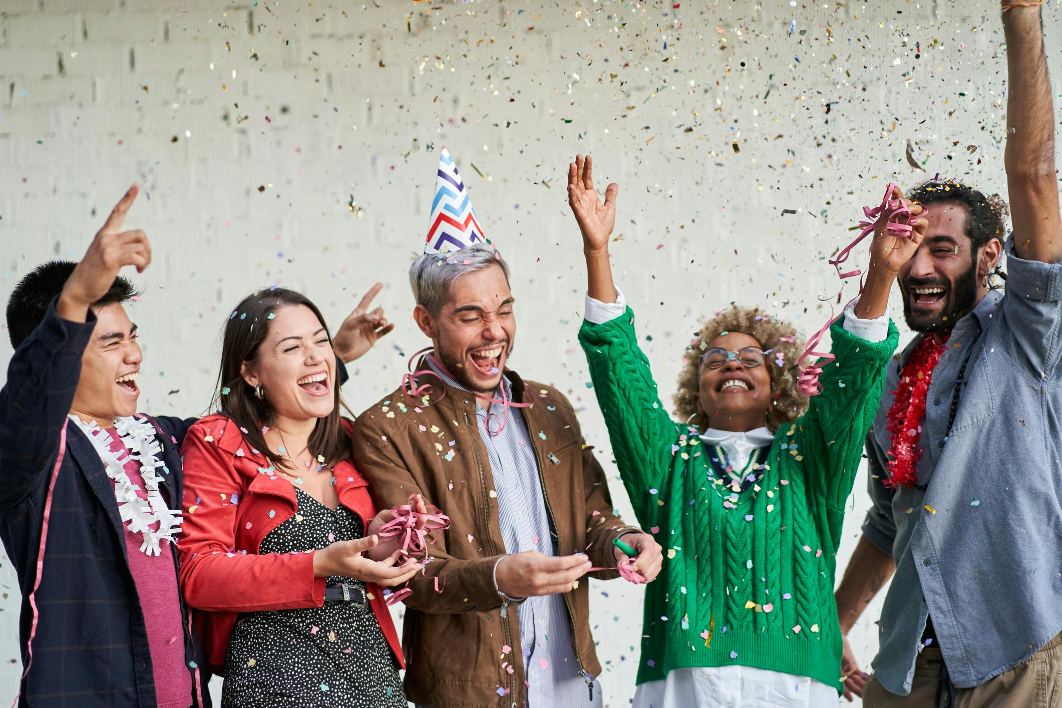 people celebrating with confetti
