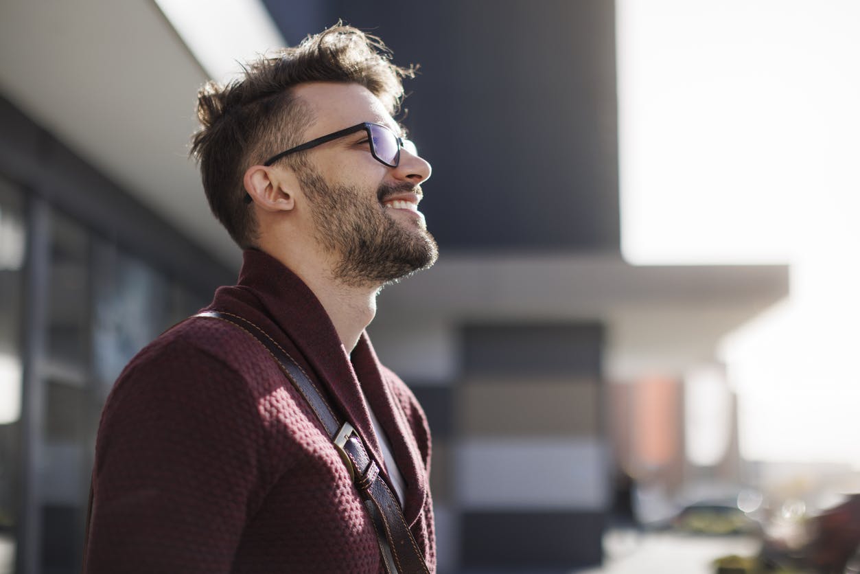 man in red shirt smiling