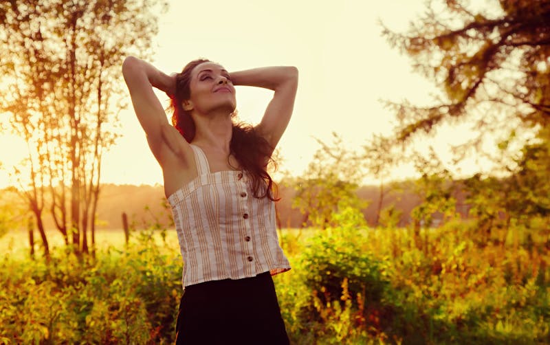 woman smiling relaxing in nature