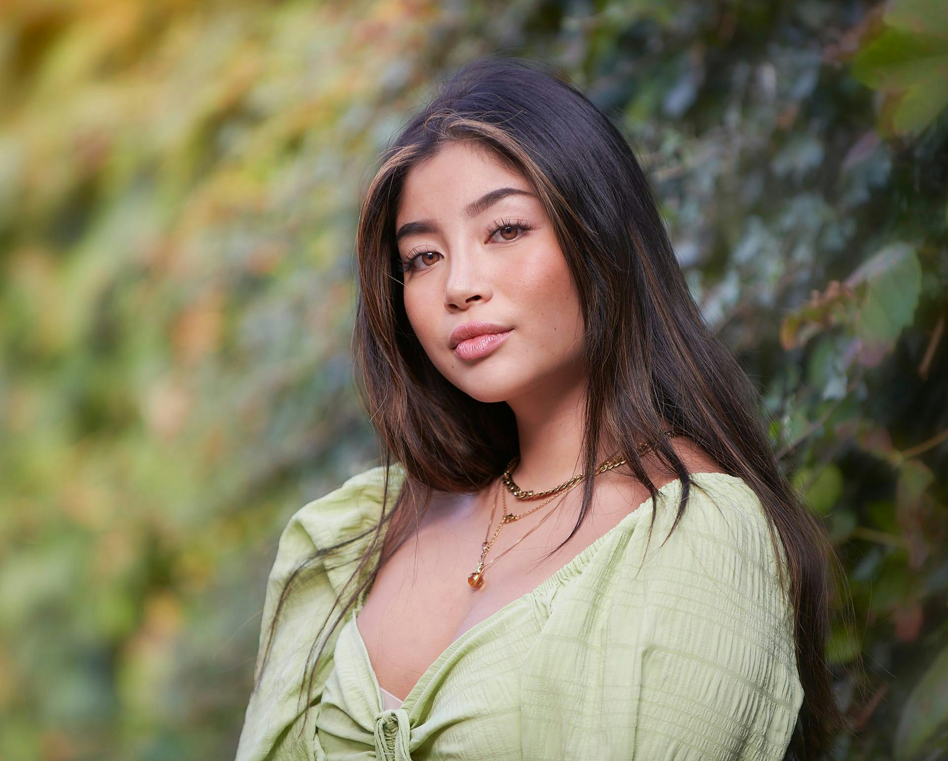 Woman in a green blouse outside