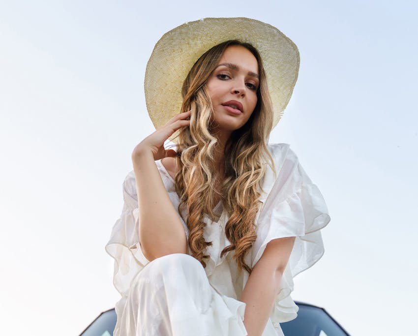 Woman in sunhat outside
