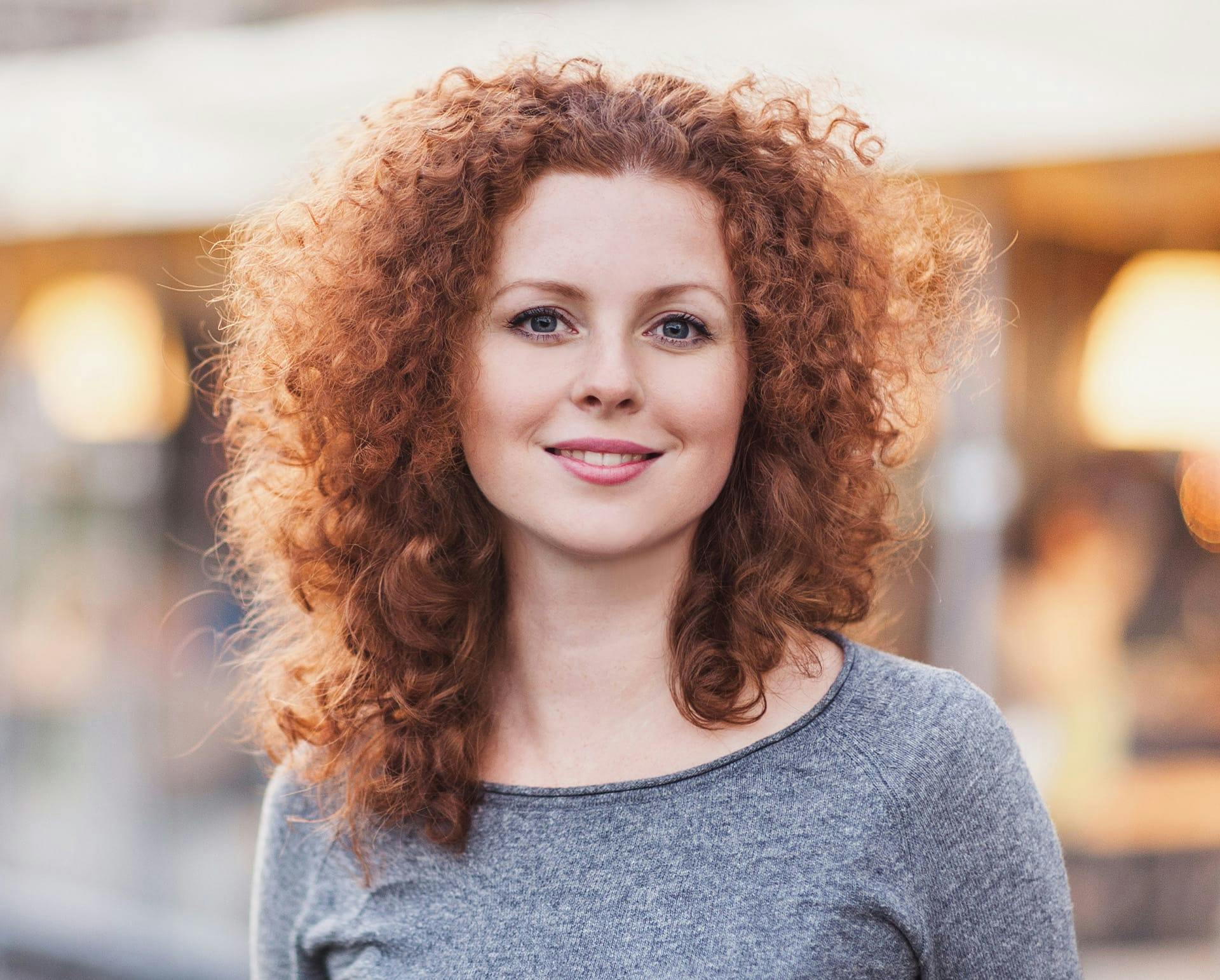 Woman with curly orange hair