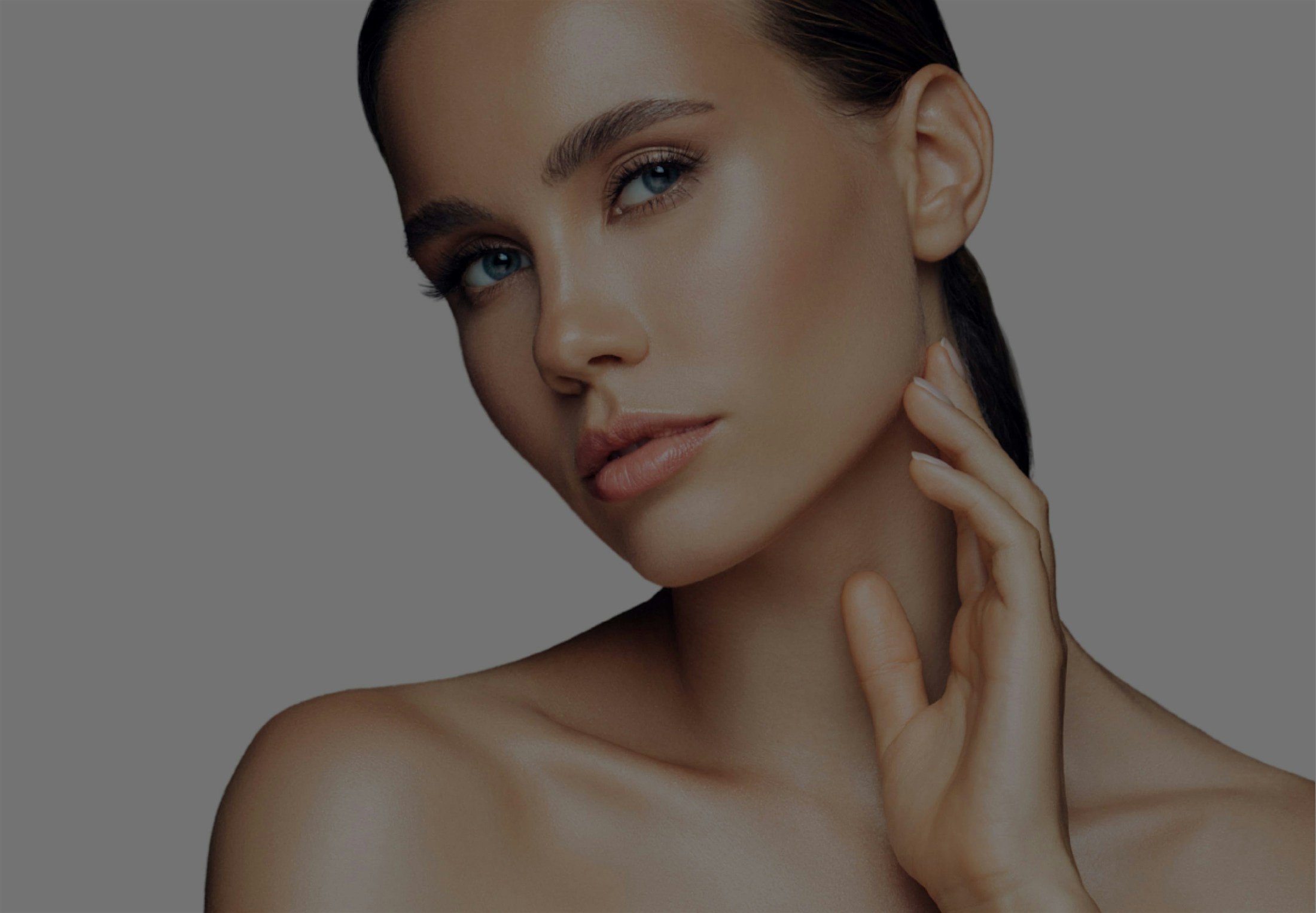 Background image of a beautiful woman touching her neck
