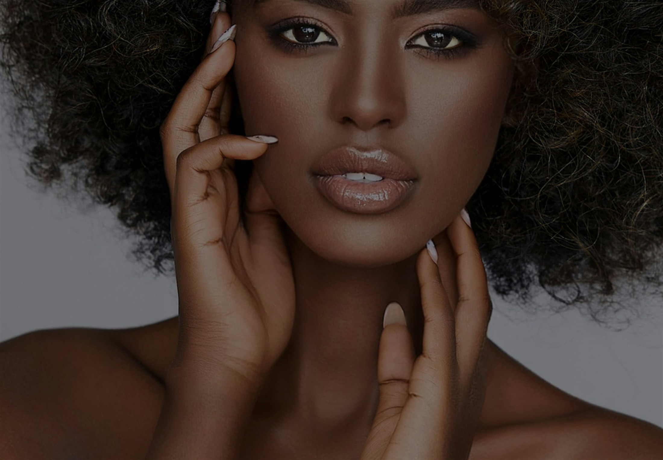 Beautiful woman holding her face