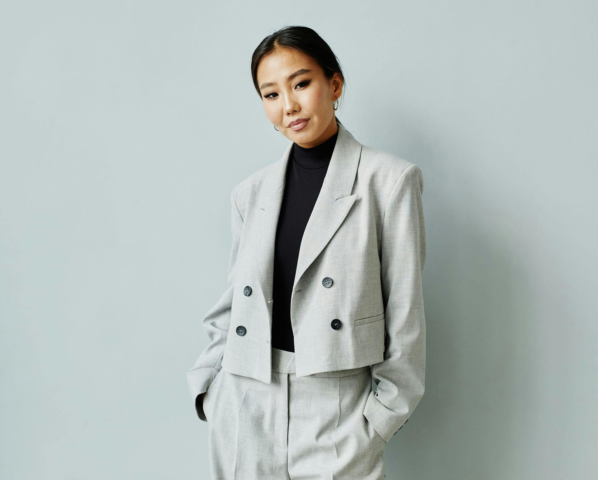 Woman in grey suit