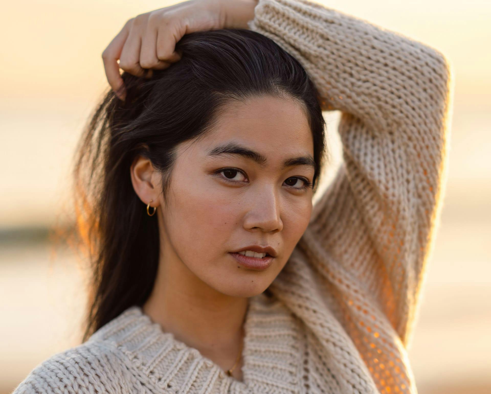 Woman in knitted sweater outside