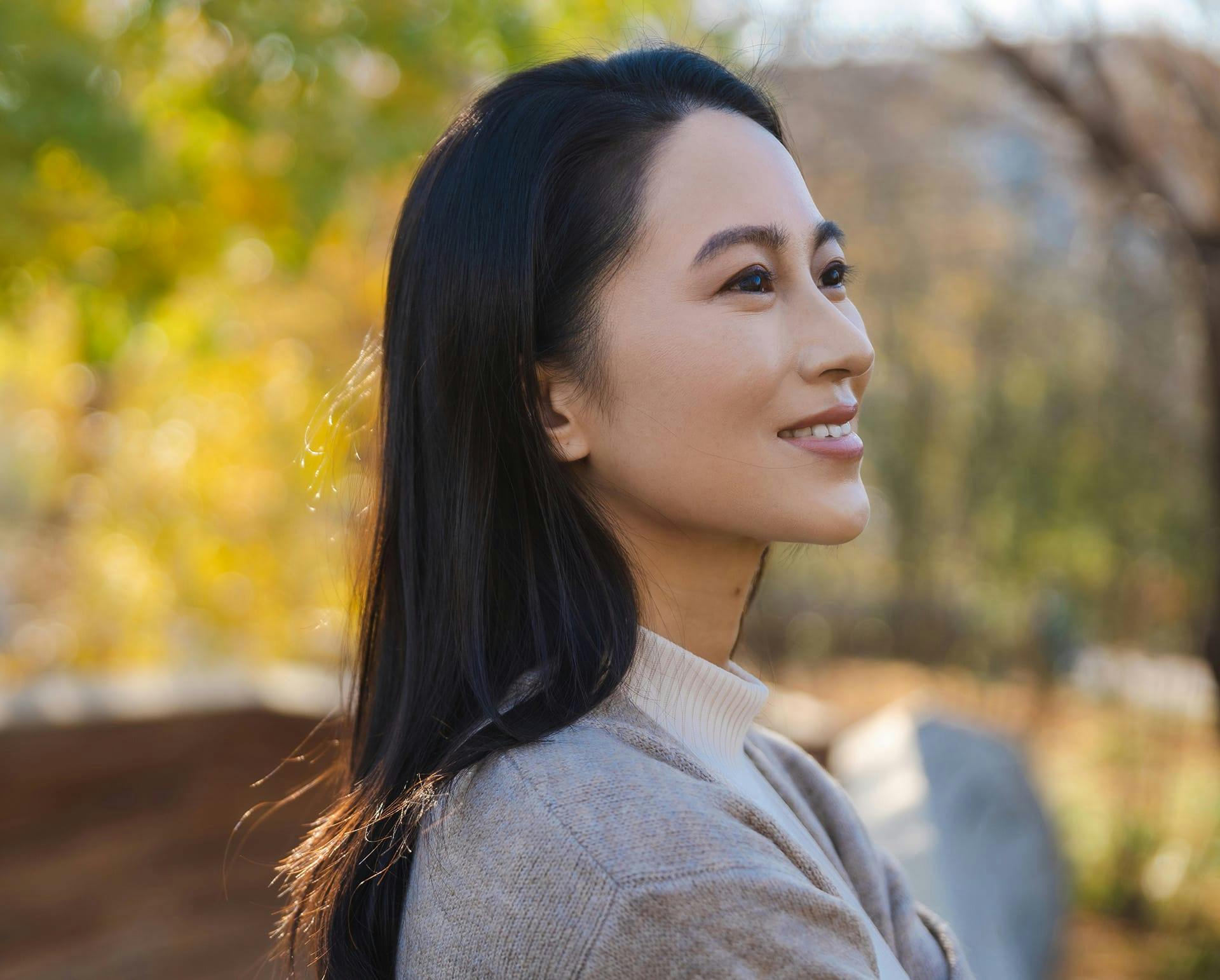 Woman outside wearing a sweater