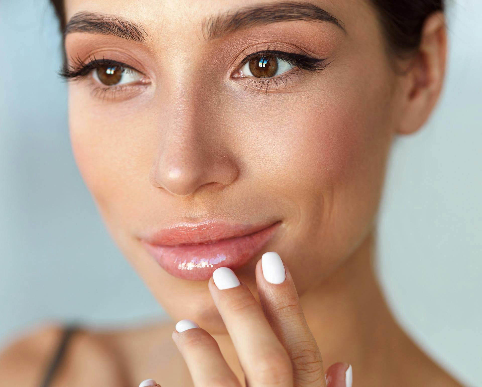 Woman touching her face