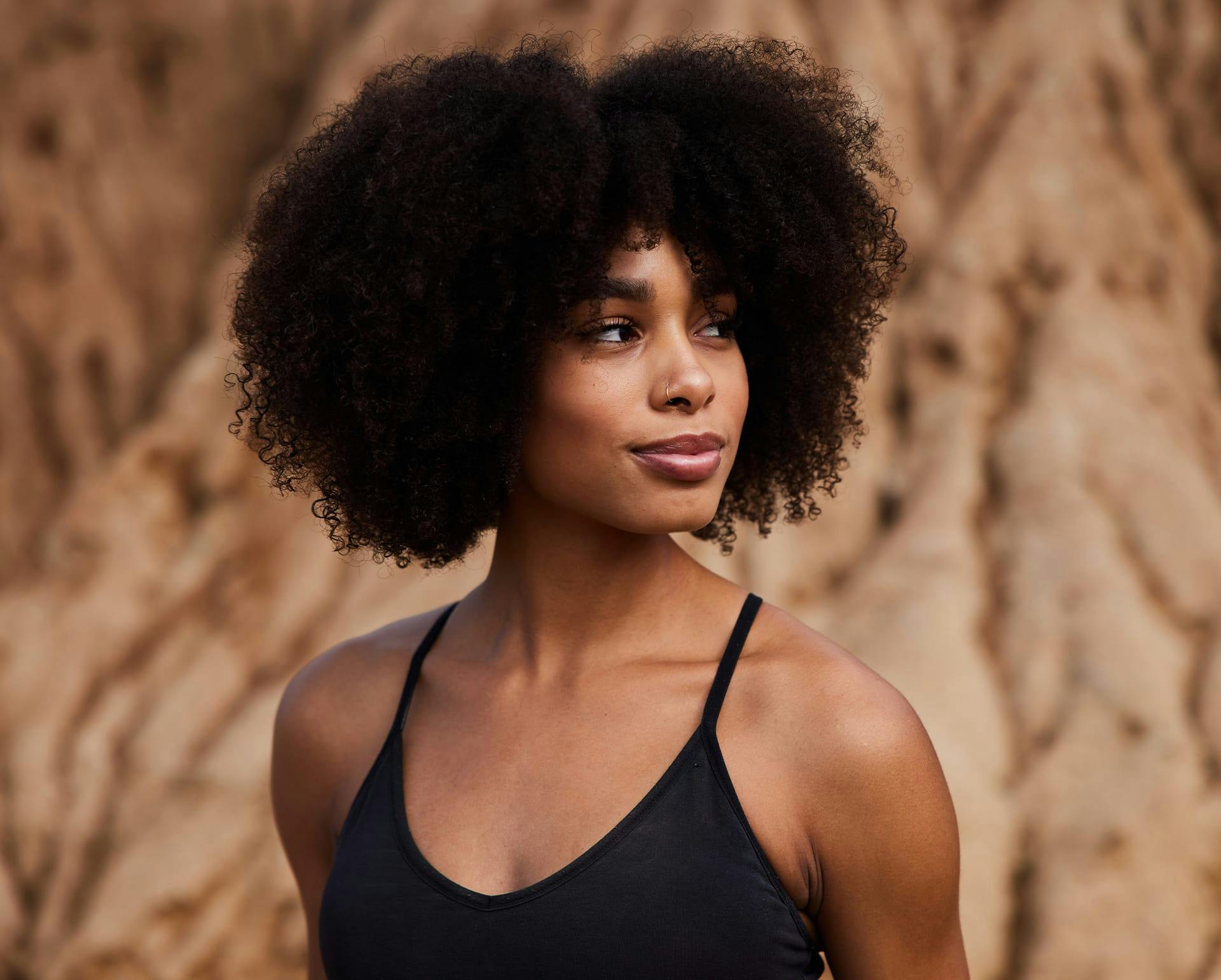 Woman in black top looking to the side