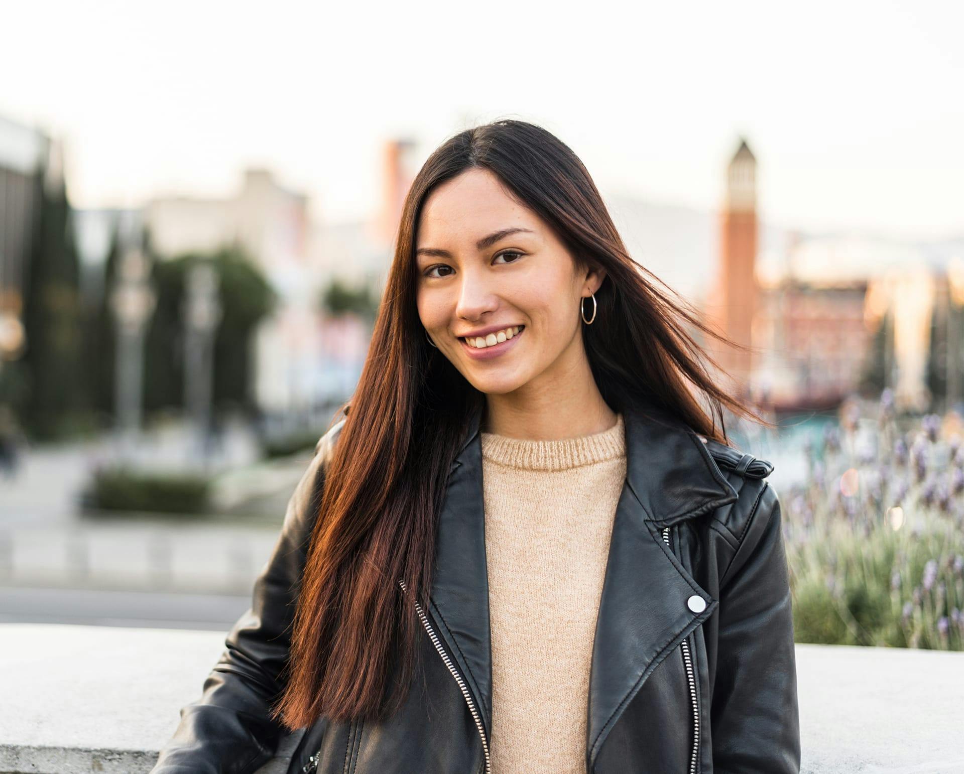 Woman outside wearing a leather jacket