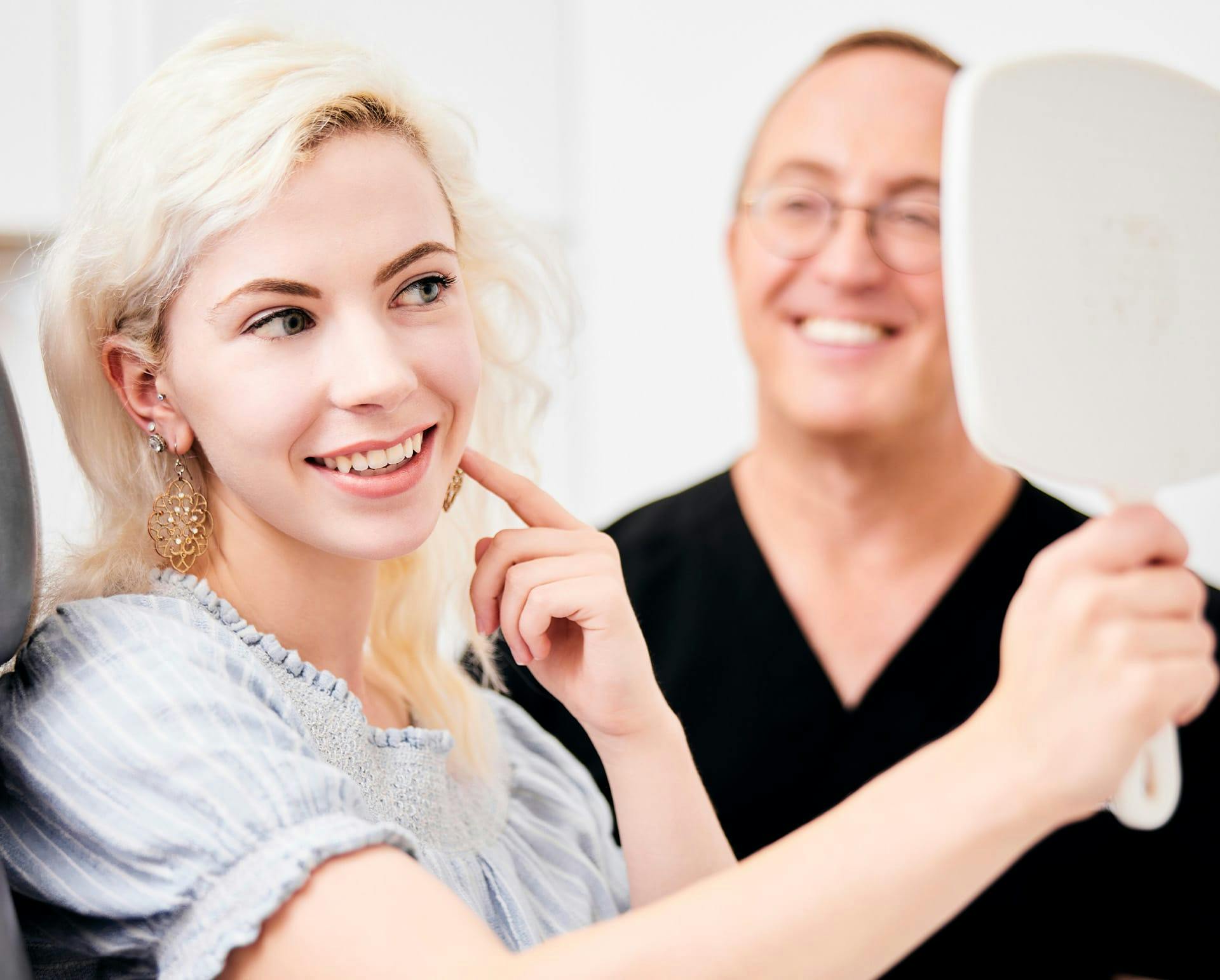 Patient looking at herself in the mirror