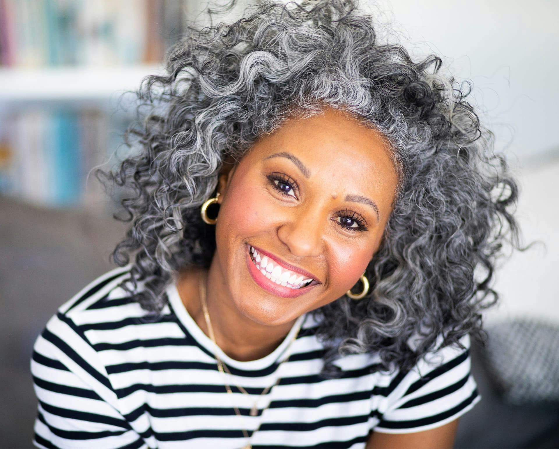 Woman in a striped shirt smiling