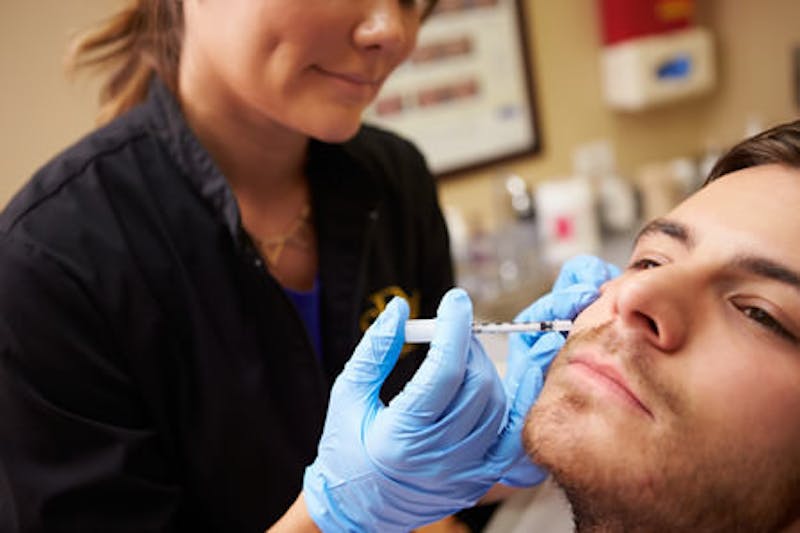 Man receiving injectable treatment