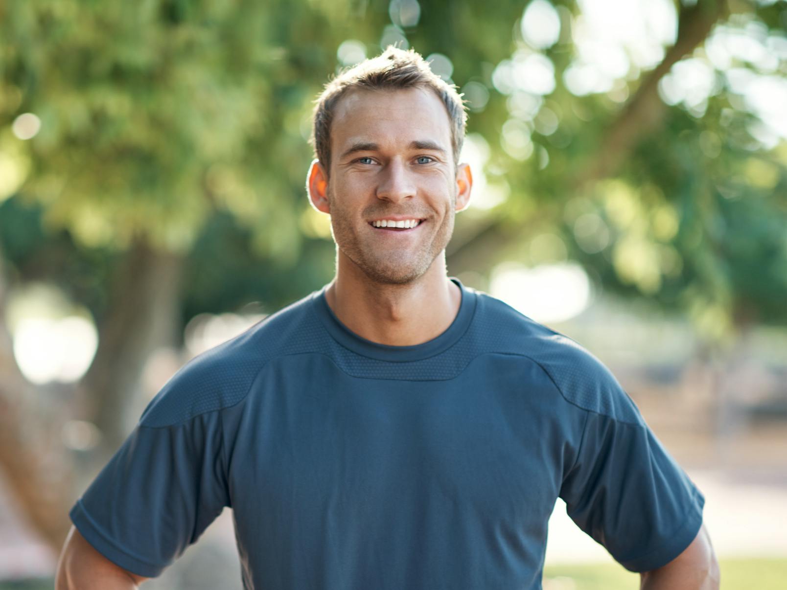 Man in blue shirt outside