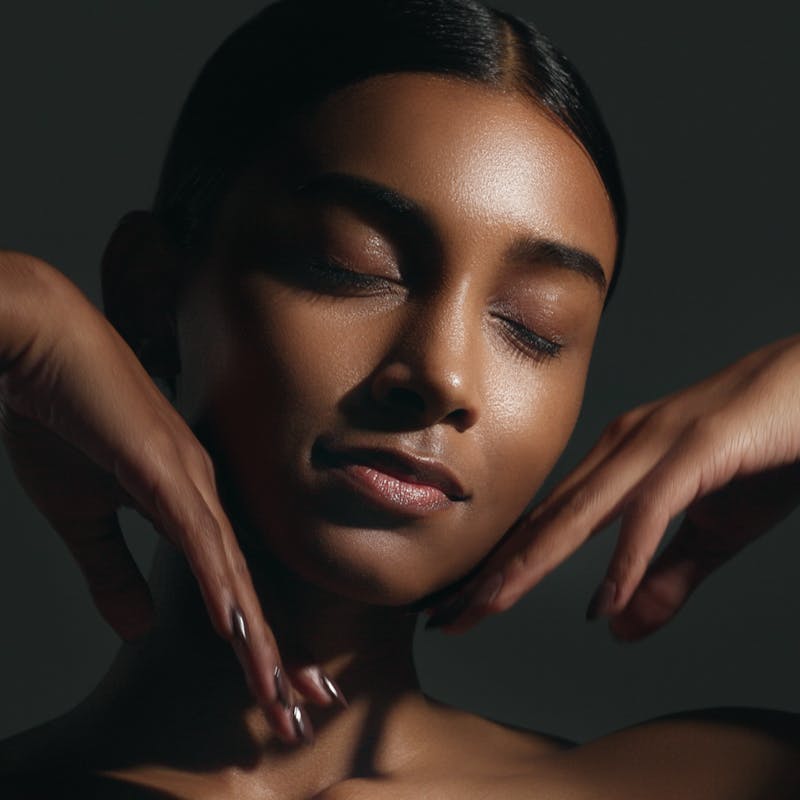 woman touching her face