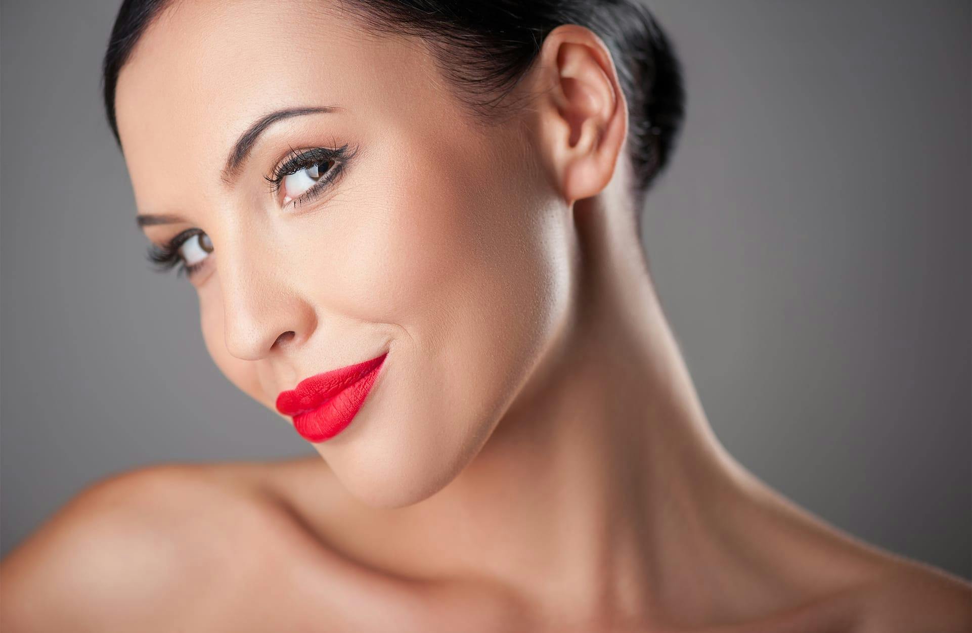woman smiling with bright red lipstick