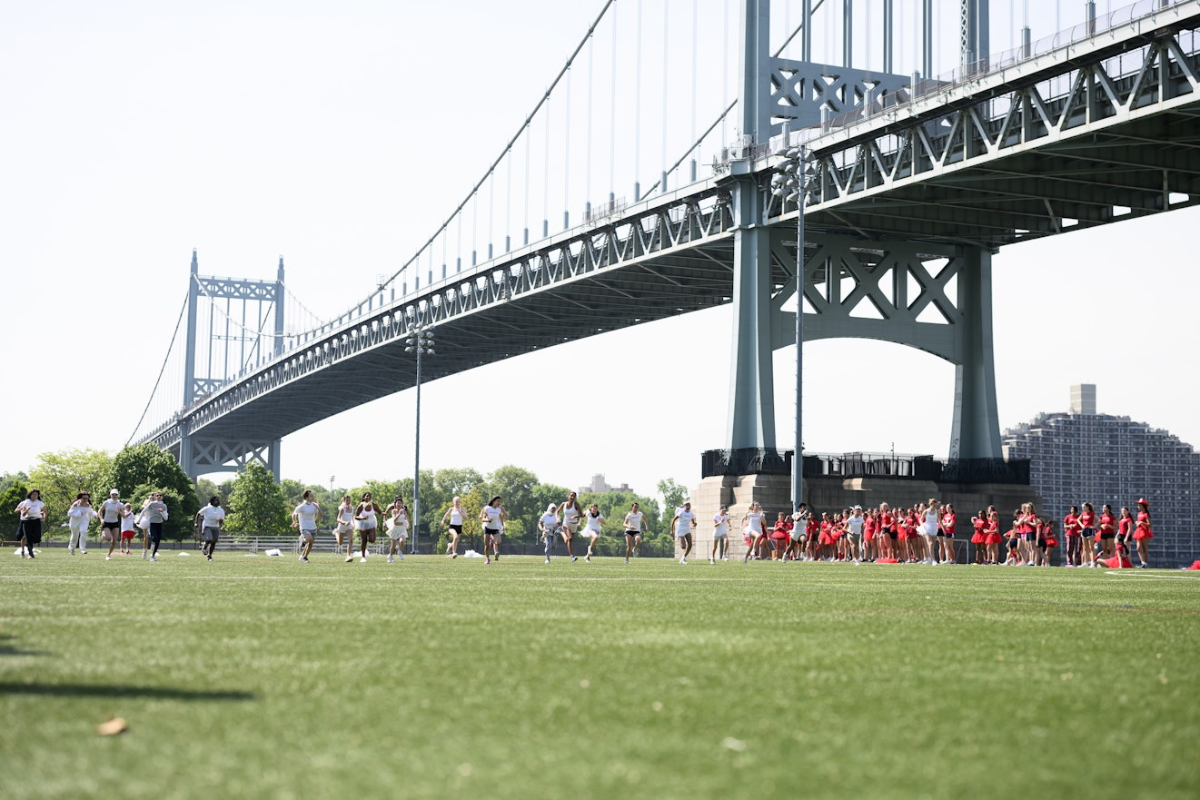 Red and white teams compete on Field Day, a Brearley tradition, on Randall's Island.