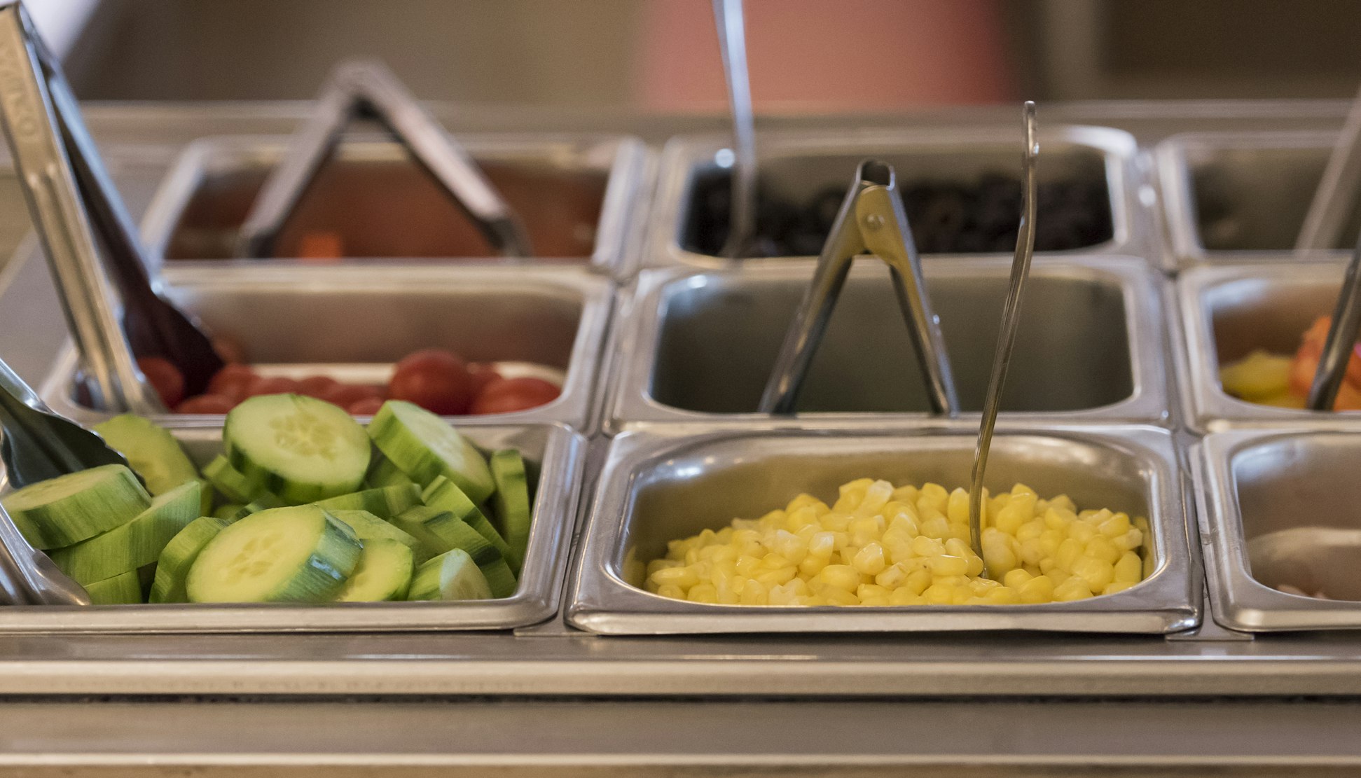 A close up of the salad bar, featuring a selection of fresh vegetables