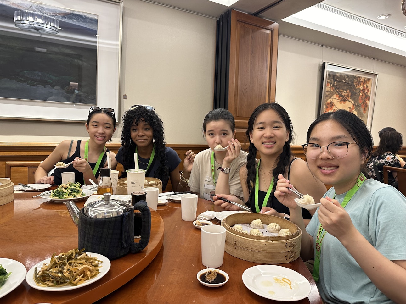 Students eating dumplings and other delicacies on their trip to Taiwan