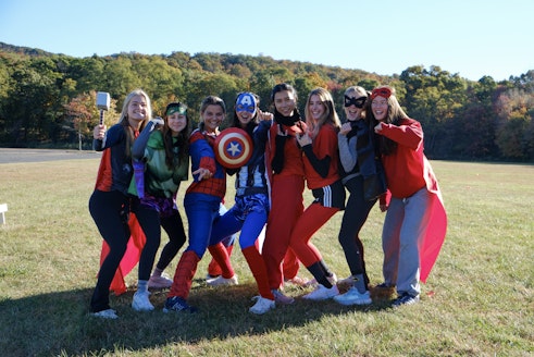 A group of seniors dressed in costumes on Mountain Day, a tradition at Brearley when the Middle and Upper School spend the day outdoors.