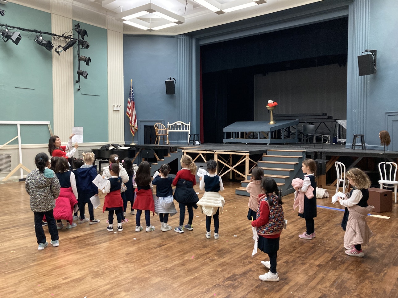 Kindergarten students visit the empty 610 Assembly Hall and see where theatrical productions take place.