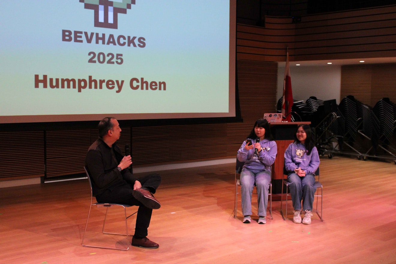 Two Upper School students interviewing the BevHacks keynote speaker, Humphrey Chen