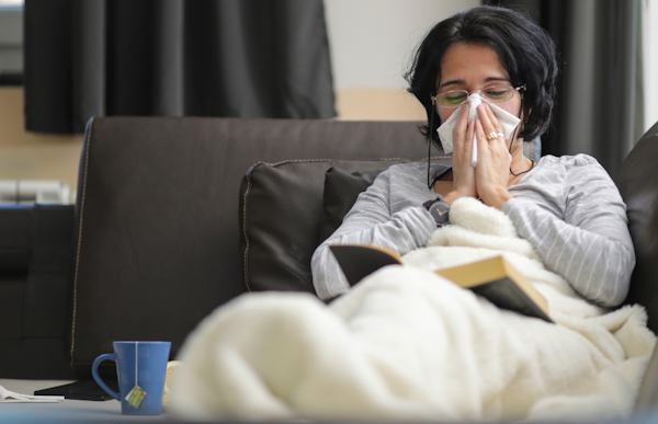 Woman at home sick