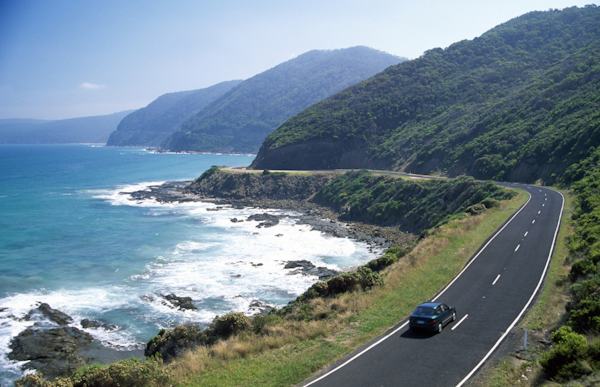 car traveling on coastal road