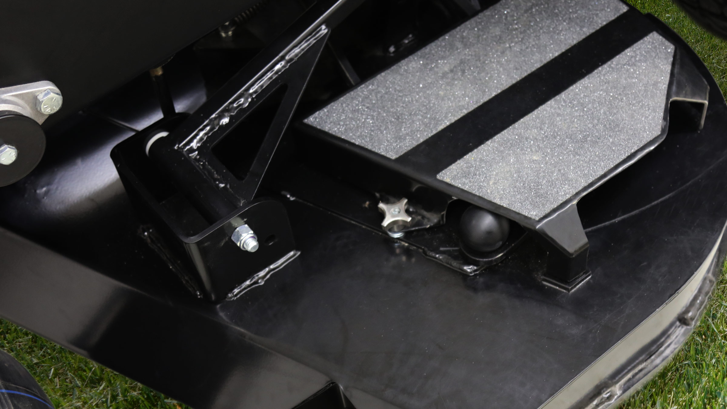 Mower deck with tool-free belt removal and sturdy pulley covers