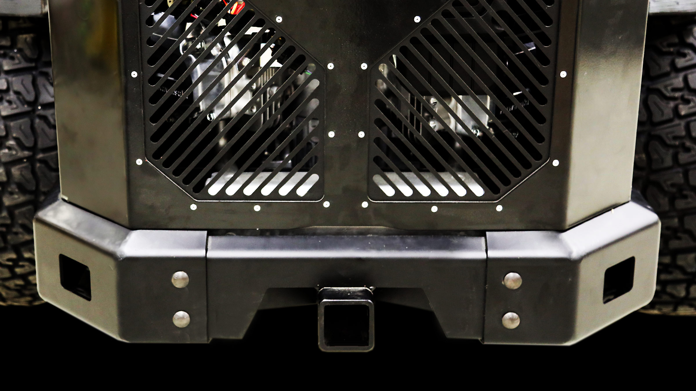 Zero-turn mower hitch receiver and bumper