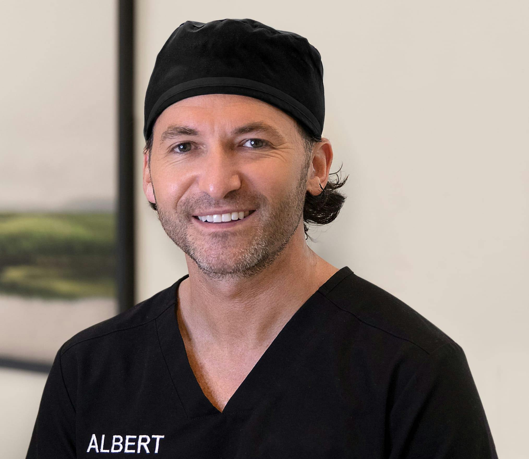Dr. Mark Albert in scrubs
