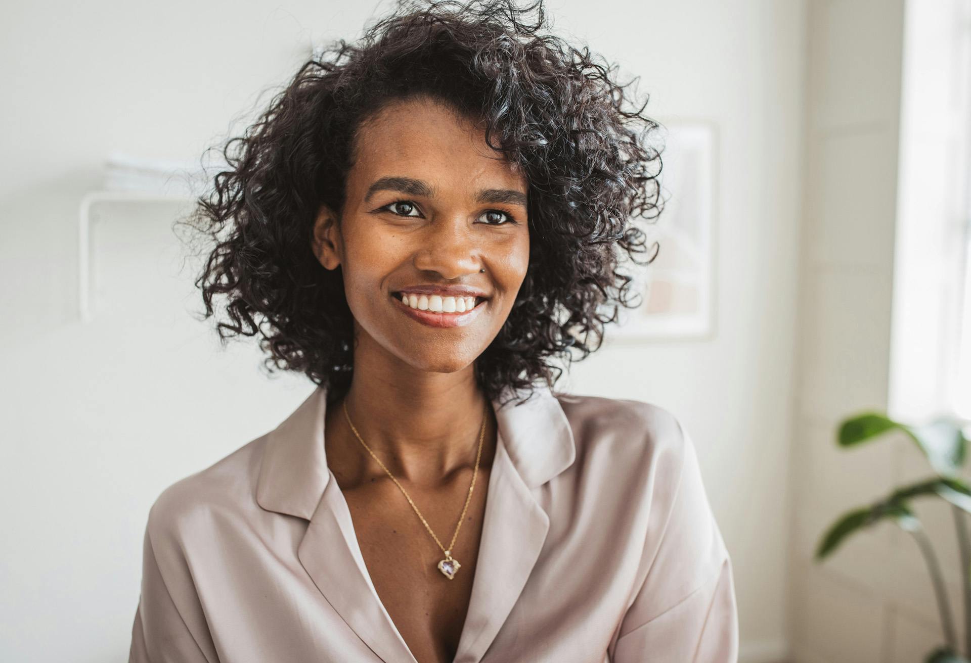 Woman with curly hair smiling