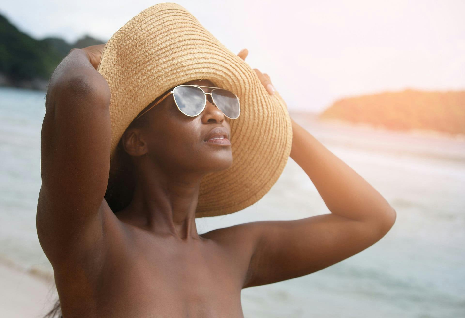 Woman wearing sunglasses looking up