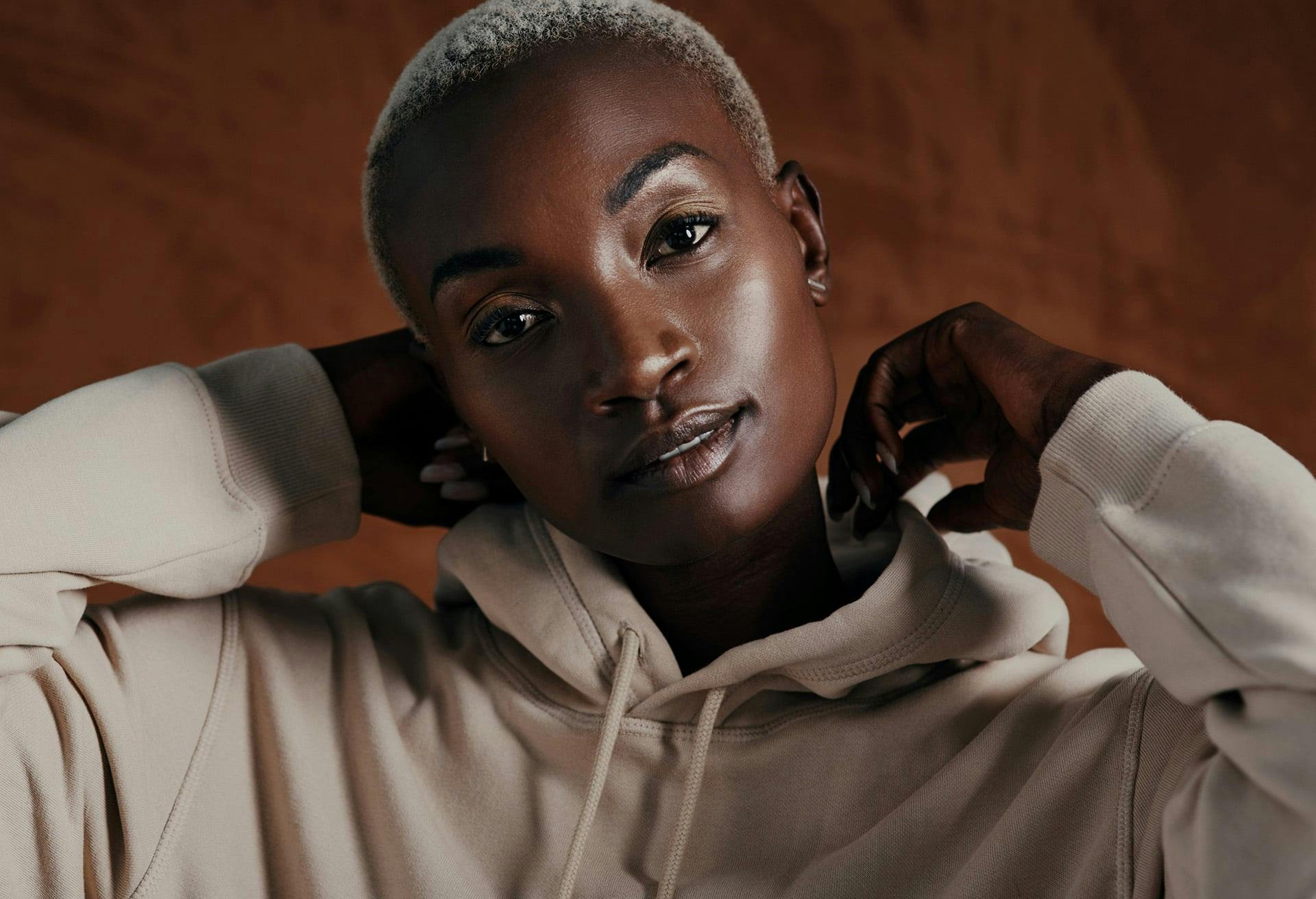 Pretty dark skinned woman wearing a hoodie