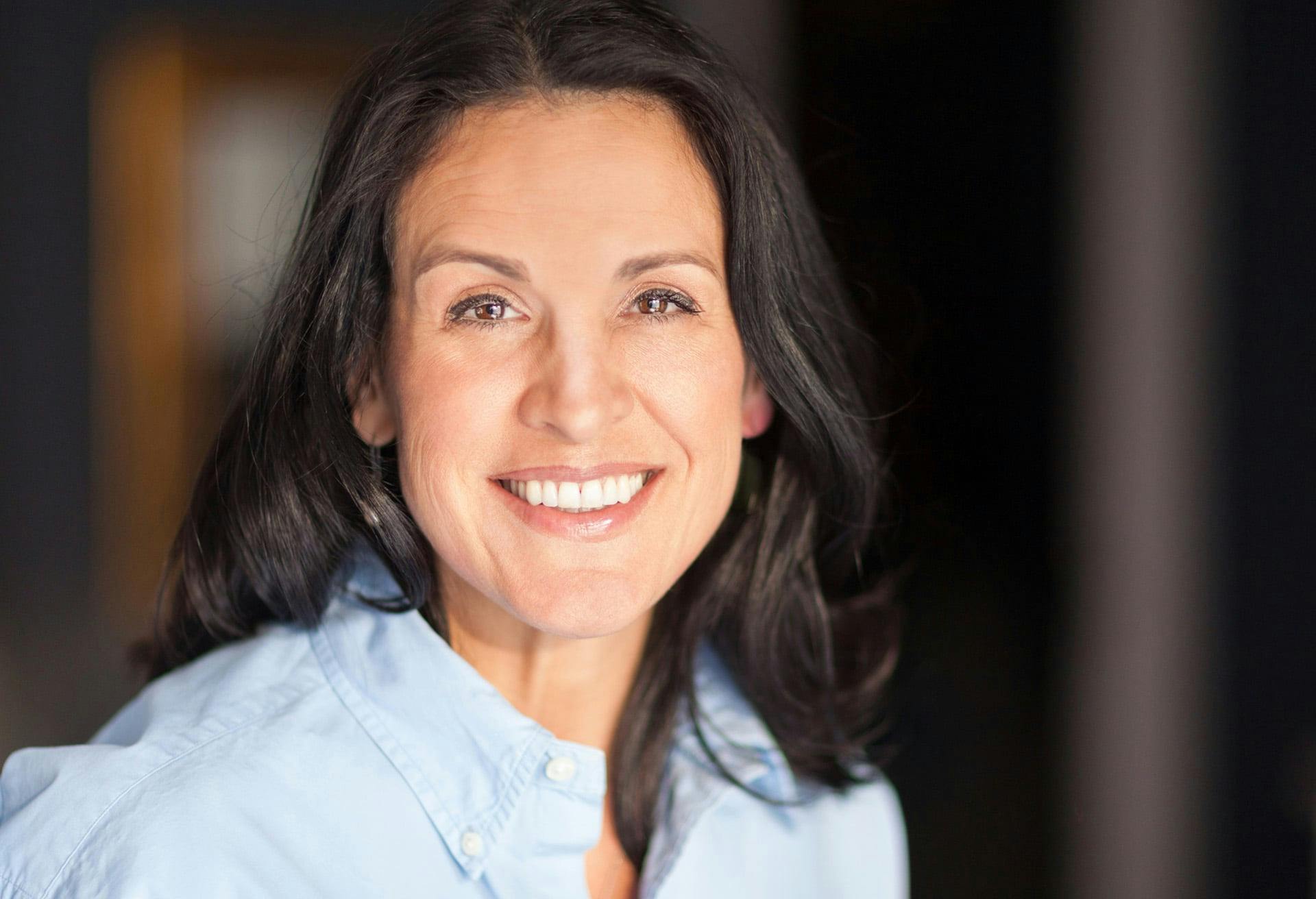 Woman with black hair smiling