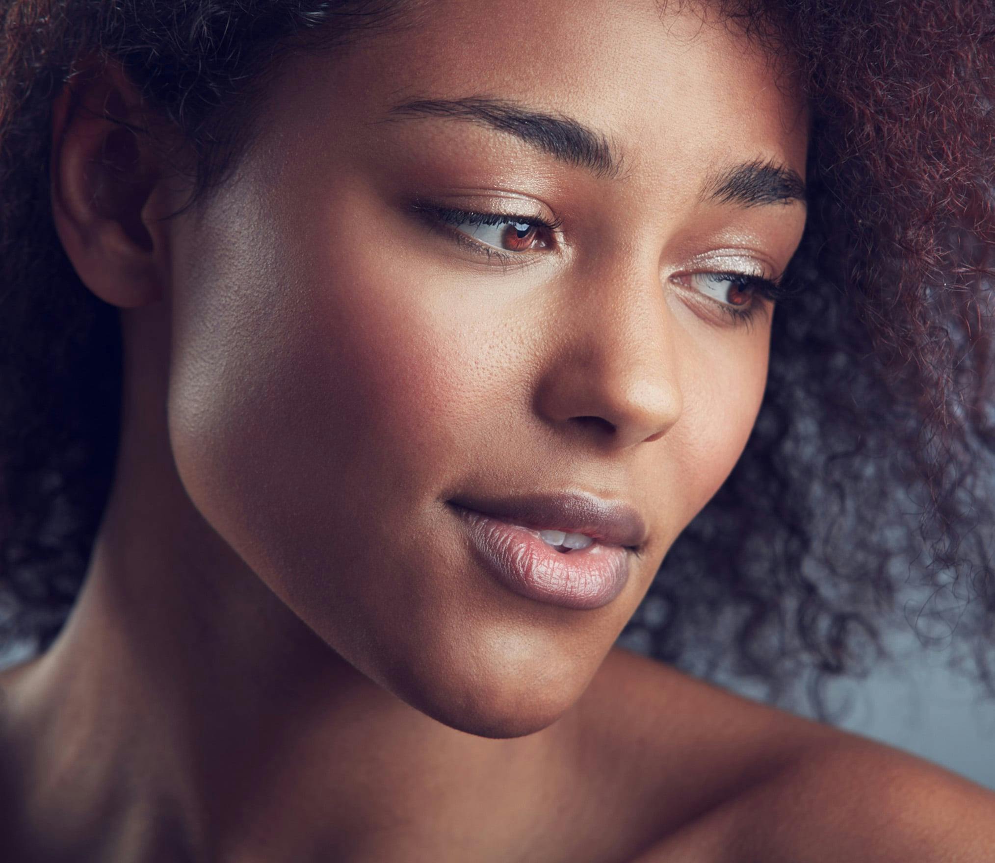 there is a woman with a very large afro looking at the camera