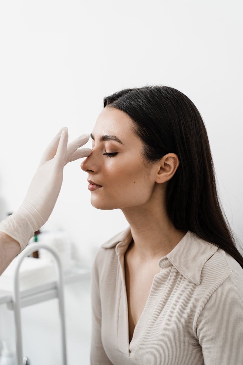 Doctor shows woman nose