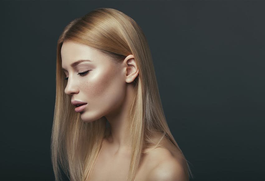 woman with mouth open looking down