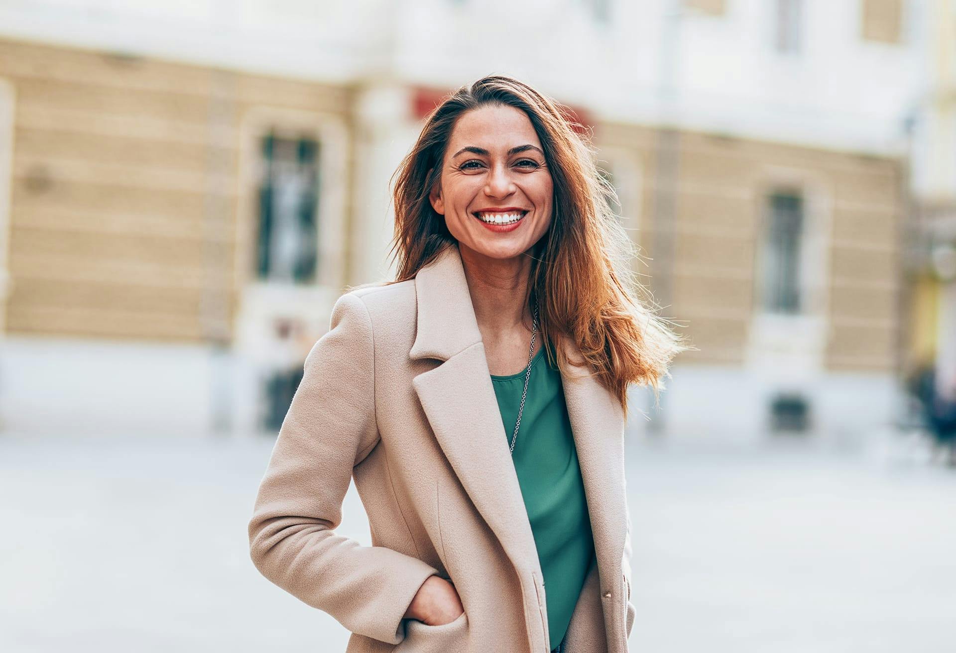 Woman in a tan coat