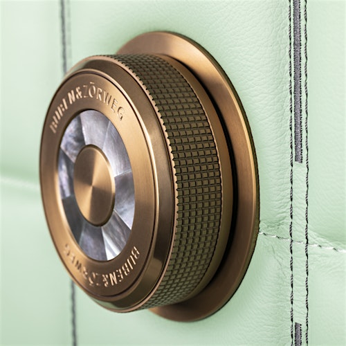 Close-up of the precision-engineered bronze-gold dial lock on the BUBEN&ZORWEG ORION high-security safe in mint green. — BUBEN&ZORWEG