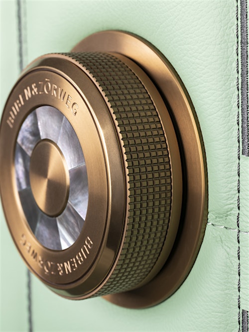 Close-up of the precision-engineered bronze-gold dial lock on the BUBEN&ZORWEG ORION high-security safe in mint green. — BUBEN&ZORWEG