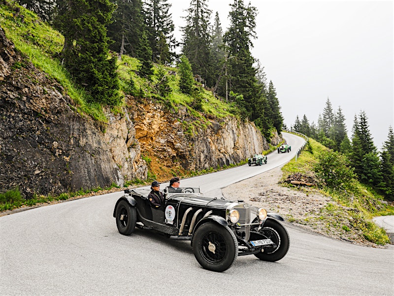 Classic car driving on winding mountain road during Ennstal-Classic rally — BUBEN&ZORWEG