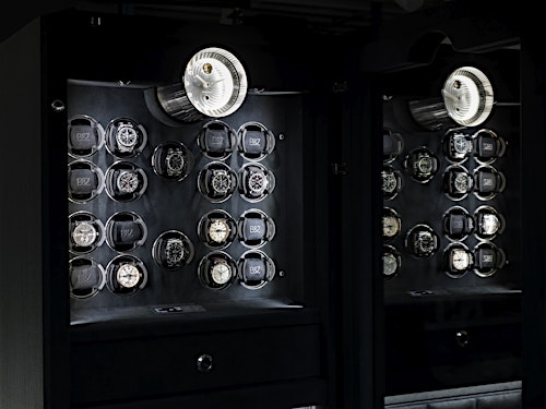 Close-up of the BUBEN&ZORWEG VISION high-security safe interior, featuring multiple watch winders and the Signature Clock. — BUBEN&ZORWEG