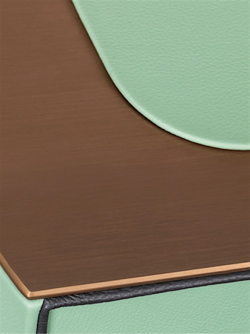 Close-up of the top detail of the BUBEN&ZORWEG ORION high-security safe in mint green with bronze-gold trim. — BUBEN&ZORWEG