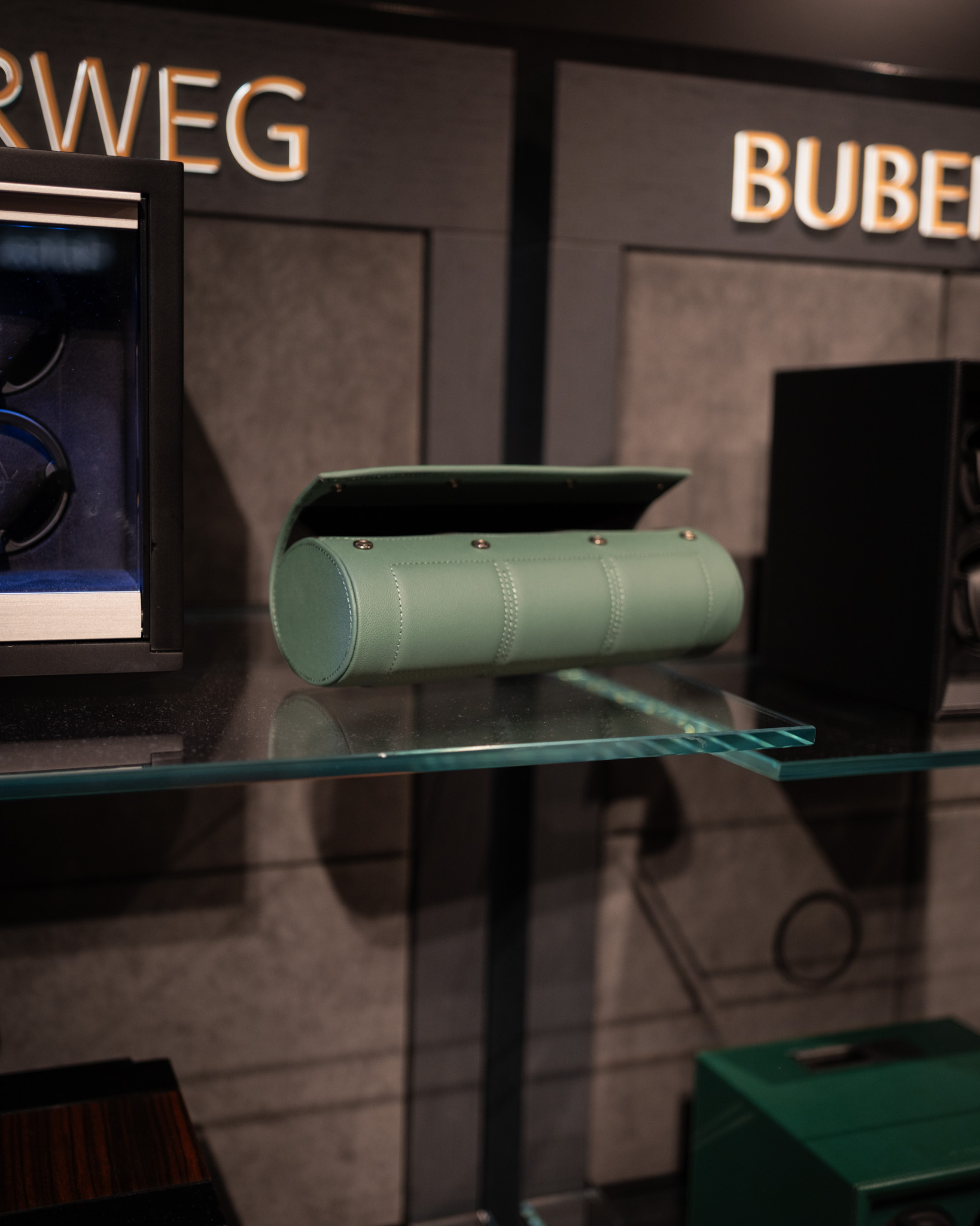 Green leather watch roll on glass shelf — BUBEN&ZORWEG