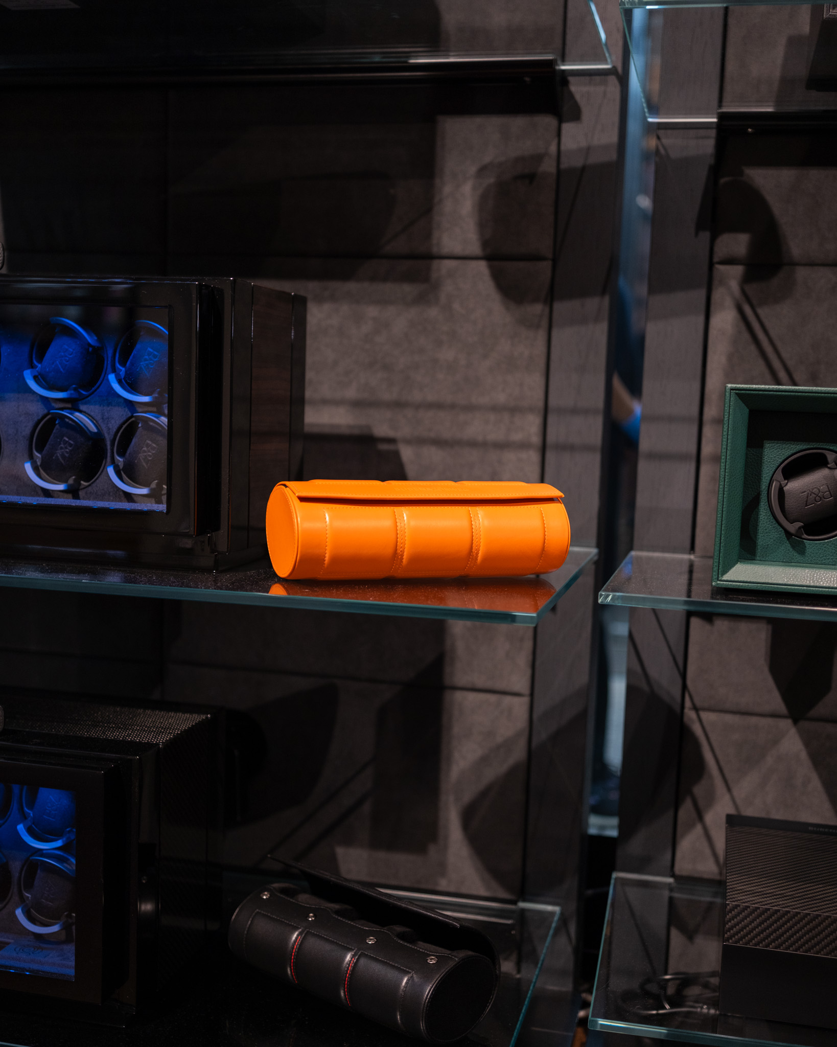 Orange leather watch roll on glass shelf — BUBEN&ZORWEG