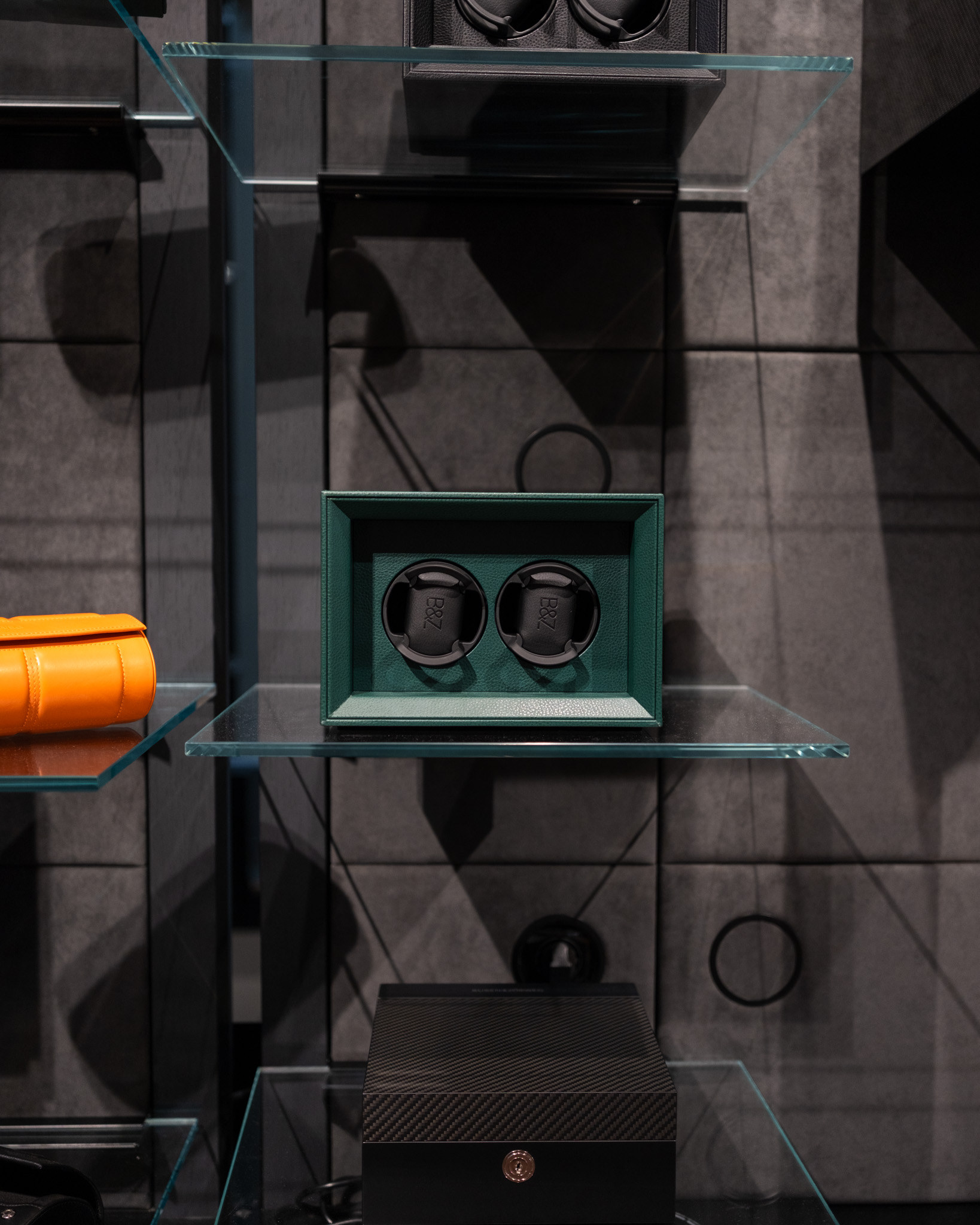 Watch winders displayed on glass shelves — BUBEN&ZORWEG