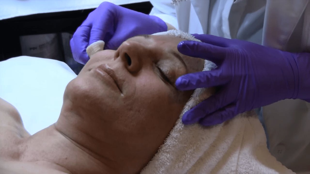woman laying down getting a facial