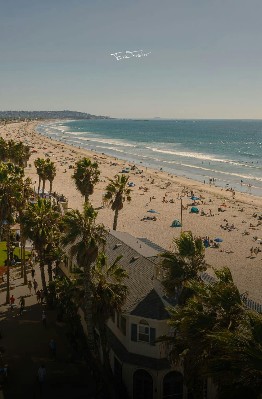 A beach with a lot of people on it
