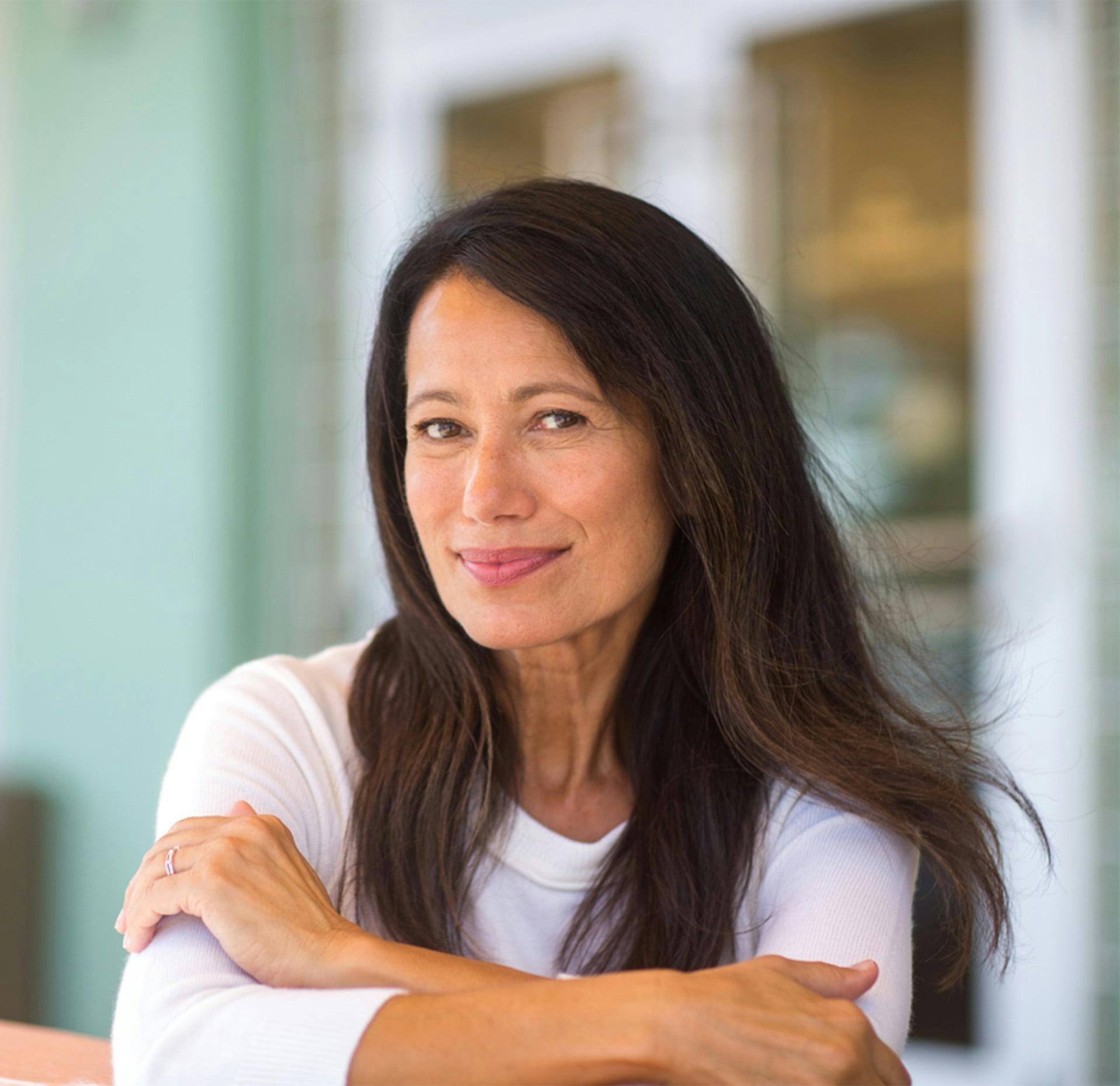 woman with brown and white shirt